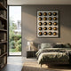 Orbivelle Black-Gold Patch Sphere & White Panel 3D Wall Art by Giant Sculptures displayed above a bed in a modern bedroom with a garden view window.