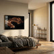 Auravalor Twin Leopards Crystal Porcelain 3D Wall Art in gold frame above a wooden bed with grey linens in a warm neutral bedroom with brass floor lamp.