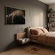 Auravalor Gold Leopard Crystal Porcelain 3D Wall Art by Giant Sculptures hung above a floating walnut nightstand in a bedroom with terracotta linens and a bookshelf.