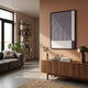 Linscape Violet Linear Wood Relief 3D Wall Art by Giant Sculptures mounted on a terracotta wall above a walnut sideboard with a brass mushroom lamp.