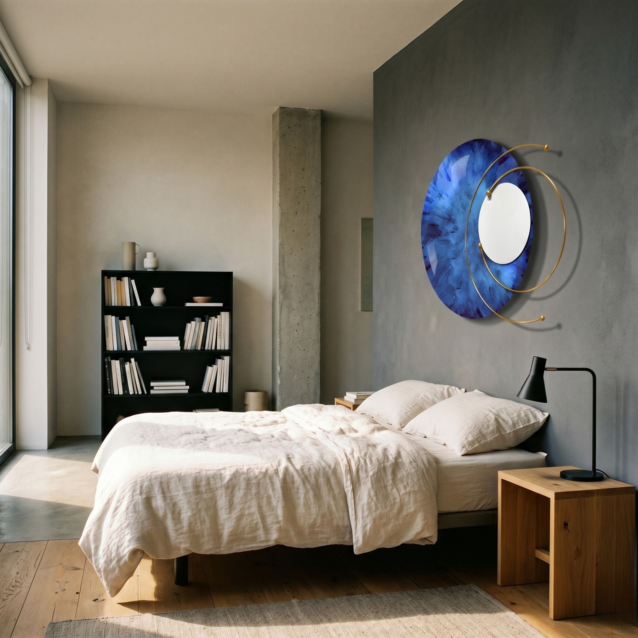 Aurelios Midnight Blue Crystal Porcelain & Gold Orbit 3D Wall Art by Giant Sculptures mounted on a grey bedroom wall above a linen bed and bookshelf.
