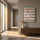 Orbivelle Amber Patch Sphere & White Panel 3D Wall Art by Giant Sculptures displayed above a walnut sideboard in a sunlit hallway with a vase of pampas grass.