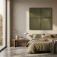 Giant Sculptures Terracrecta Olive Painted Textured Square 3D Wall Art mounted above a bed with olive linen bedding, beside a wooden nightstand and tall window.