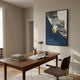 Arclustre Navy Pleated Leather Architectural 3D Wall Art by Giant Sculptures displayed above a wooden desk with lamp and books in a neutral home office.