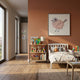 Blossomkin Bird 3D Floral Wall Art by Giant Sculptures displayed in a child's bedroom with terracotta wall, white toddler bed, plush toys, and bookshelf.