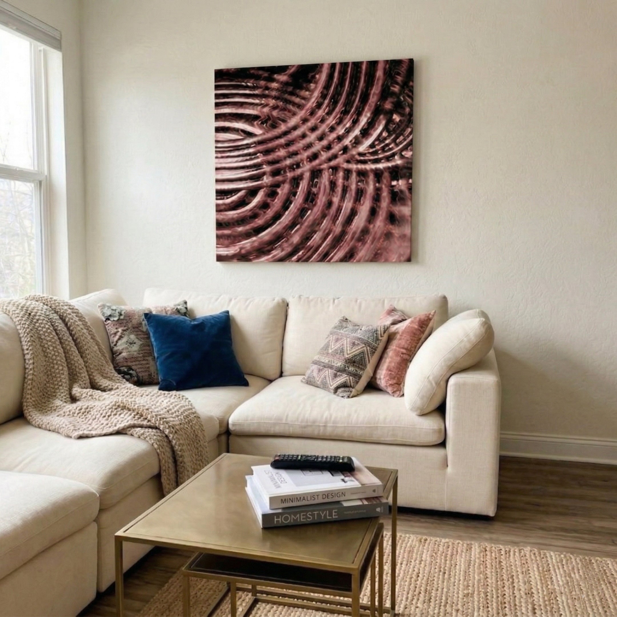 Rillora Burgundy Ribbed Wood Carving 3D Wall Art by Giant Sculptures mounted above a cream sectional sofa in a neutral living room with gold coffee table and decorative pillows.