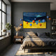 Aerisphere Mountain Glow 3D Wall Art with blue and orange metal balls displayed above a bed in a dark grey bedroom with wooden nightstand.