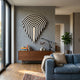 Arclune Black & White Stripe Sculptural Felt 3D Wall Art by Giant Sculptures mounted above a walnut sideboard in a modern living room with a blue sofa.
