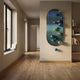 Virellon Blue Gradient 3D Wall Art with navy and silver metal balls on a ribbed oval panel, mounted in a hallway beside a bookshelf and window.