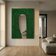 Arclunor Forest Green Arch Relief Mirror 3D Wall Art displayed on a cream wall in a modern living room with oak floors and a beige sofa.