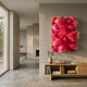 Chromavolt Fuchsia Burst Straw 3D Wall Art by Giant Sculptures, mounted above a light wood console with books in a sunlit modern hallway.