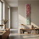 Aeraline Rose Mist Vertical Gradient Leather 3D Wall Art by Giant Sculptures, mounted in a sunlit hallway above a low oak bookshelf with brass lamp.