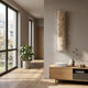 Aeraline Snowlit Ivory Vertical Gradient Leather 3D Wall Art mounted on a beige wall in a Nordic hallway with oak sideboard, ceramic vase, and pilea plant.