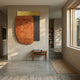 Halvoria Grey & Terracotta Fibre Panel 3D Wall Art by Giant Sculptures, with terracotta fibre, dark ribbed panel, and brass top, mounted in a sunlit hallway.