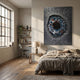 Vorthera Steel Rift Textured Silver 3D Wall Art with a blue and rust iris-like core on a silver-grey field, mounted above a bed in a sunlit bedroom.