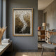 Spiravale Gold Gradient Floral Curl 3D Wall Art by Giant Sculptures in a wood frame, displayed on a grey wall in a modern living room with bookshelf.
