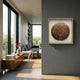 Aureliare Bronze Fade Rolled Floral Framed 3D Wall Art in a light wood frame on a grey wall, beside a modern living room with a grey sofa and walnut console.