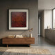 Fiorenze Red & Gold Scratch Textured Square 3D Wall Art by Giant Sculptures displayed above a walnut console with books and a vase in a modern grey hallway.