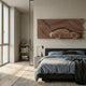 Velocedra Wooden Sportscar 3D Relief Wall Art by Giant Sculptures mounted above a dark bed with blue linens in a modern bedroom with wood flooring.