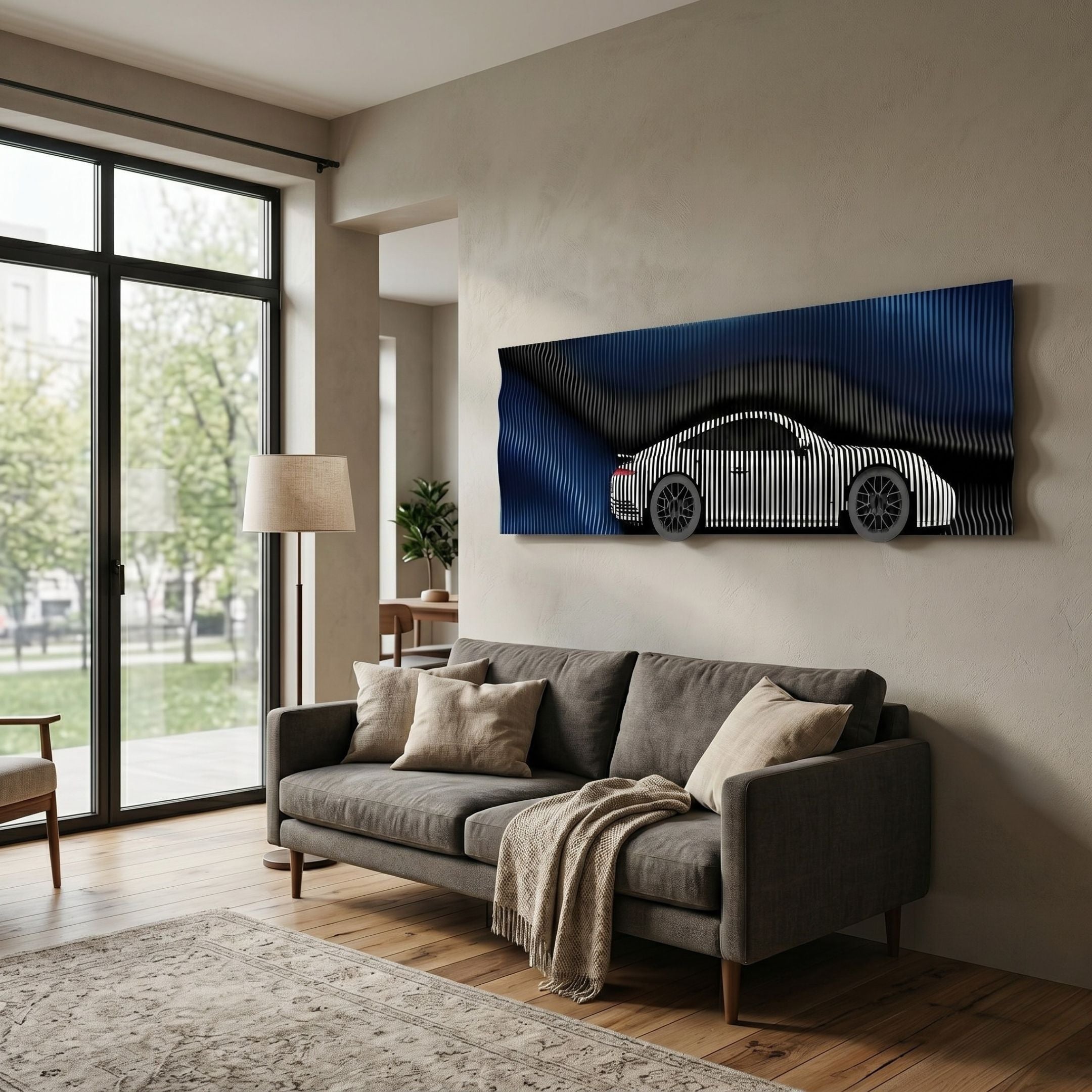 Velocedra Blue Gradient Silver Sportscar 3D Relief Wall Art by Giant Sculptures displayed above a grey sofa in a modern living room with large windows.