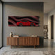 Velocedra Red Sportscar 3D Relief Wall Art mounted above a walnut sideboard in a modern hallway, showing the layered red car against striped backdrop.