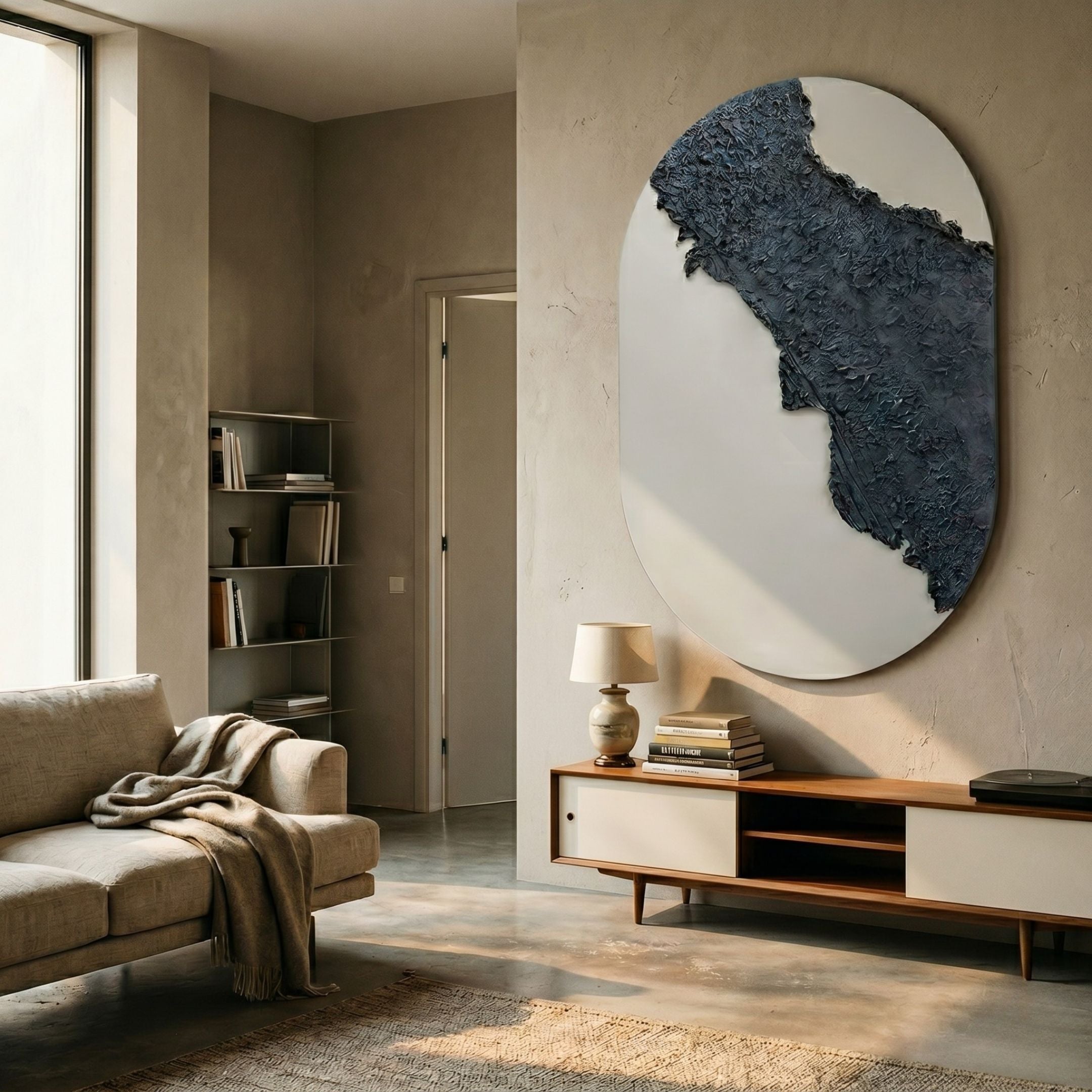 Orrica Deep Charcoal Textured Relief 3D Wall Art by Giant Sculptures mounted on a pale plaster wall above a wooden console in a neutral living room.