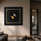 Havantra Cutter & Torch Cigar Accessory Framed Wall Art by Giant Sculptures, with yellow torch lighter and silver cutter on black, displayed in a living room.