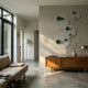 Orbiora Green Orb 4-Panel Concentric Sphere 3D Wall Art by Giant Sculptures arranged diagonally on a beige wall above a wooden sideboard in a modern living room.