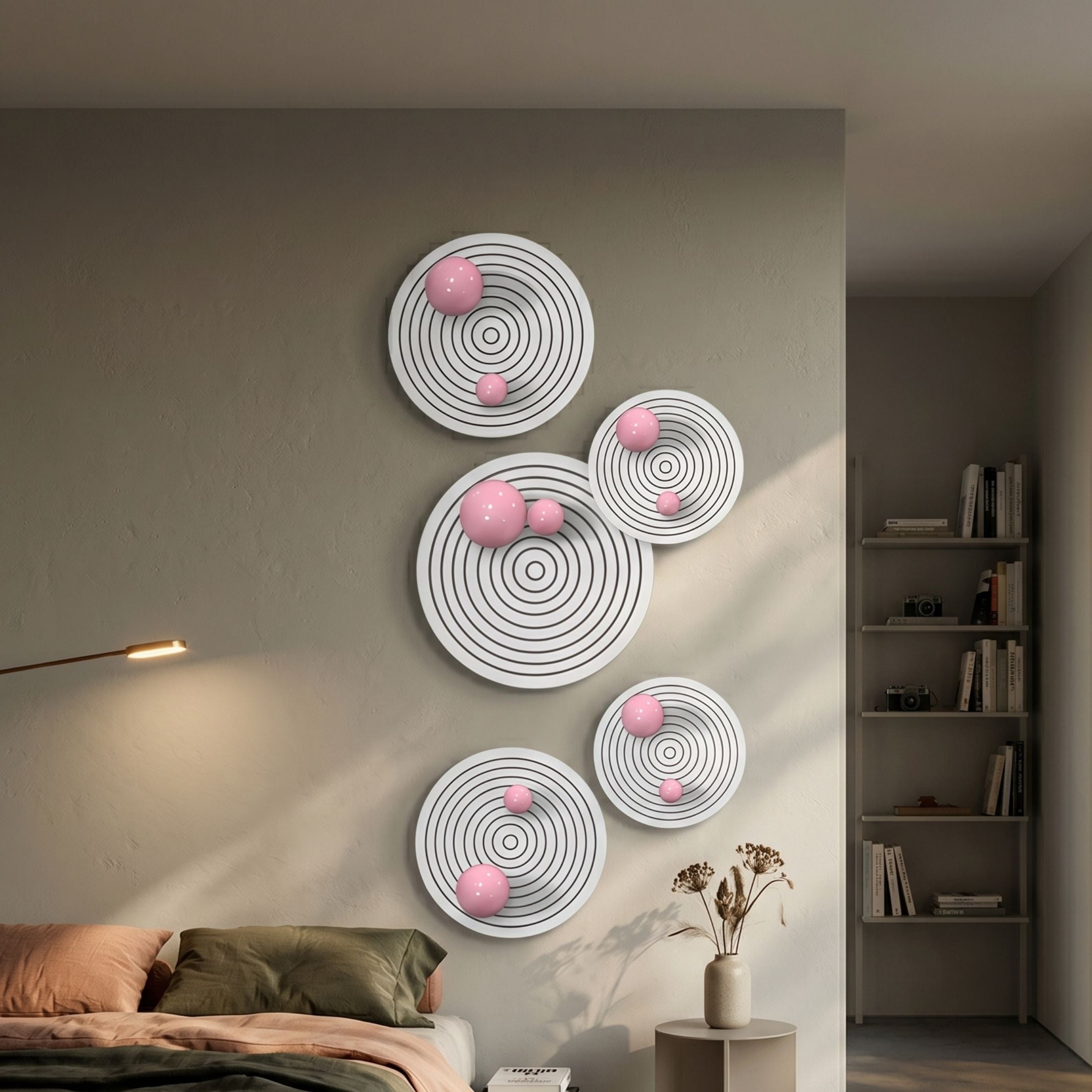 Orbiora Pink Orb 5-Panel Concentric Sphere 3D Wall Art by Giant Sculptures displayed on a bedroom wall above a bed, beside a floor lamp and bookshelf.