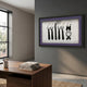 Cravatto Black Tie & Bow Framed 3D Wall Art by Giant Sculptures displayed on a grey wall above a wooden desk in a modern office with a window.