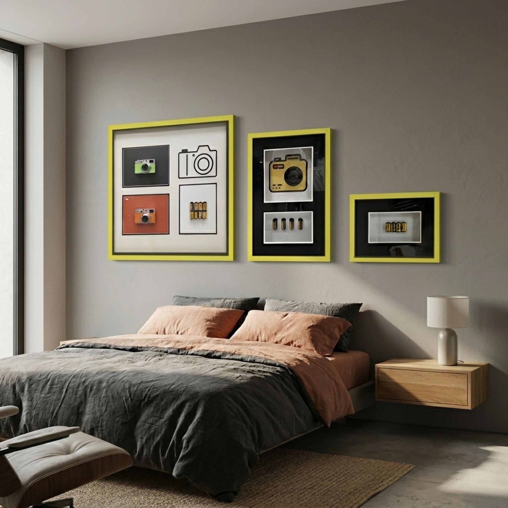 Fotura 3-Set Camera Themed Framed 3D Wall Art by Giant Sculptures with yellow frames above a bed with grey and peach bedding in a modern bedroom.