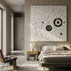 Orbryne Black & White Constellation Abstract 3D Wall Art mounted above a bed in a minimalist bedroom with a wooden nightstand, lamp, and neutral linens.