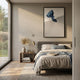 Avalora II Blue Crest Abstract Geometric 3D Wall Art by Giant Sculptures displayed above a linen-dressed bed with a brass lamp and dried palm in a sunlit bedroom.