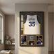 Legends Kevin Durant #35 Warriors Jersey Framed Wall Art by Giant Sculptures displayed in a hallway with bookshelves, featuring the white jersey and action photos.