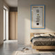 Vitara Silver Flask & Gold Seal Cigar Framed 3D Wall Art by Giant Sculptures displayed on a cream bedroom wall above an oak bed with grey linens.