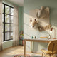 Animora Deer & Elephant Cream Kids Plush 3D Wall Art by Giant Sculptures mounted in a sage green children's room above a wooden desk near a window.