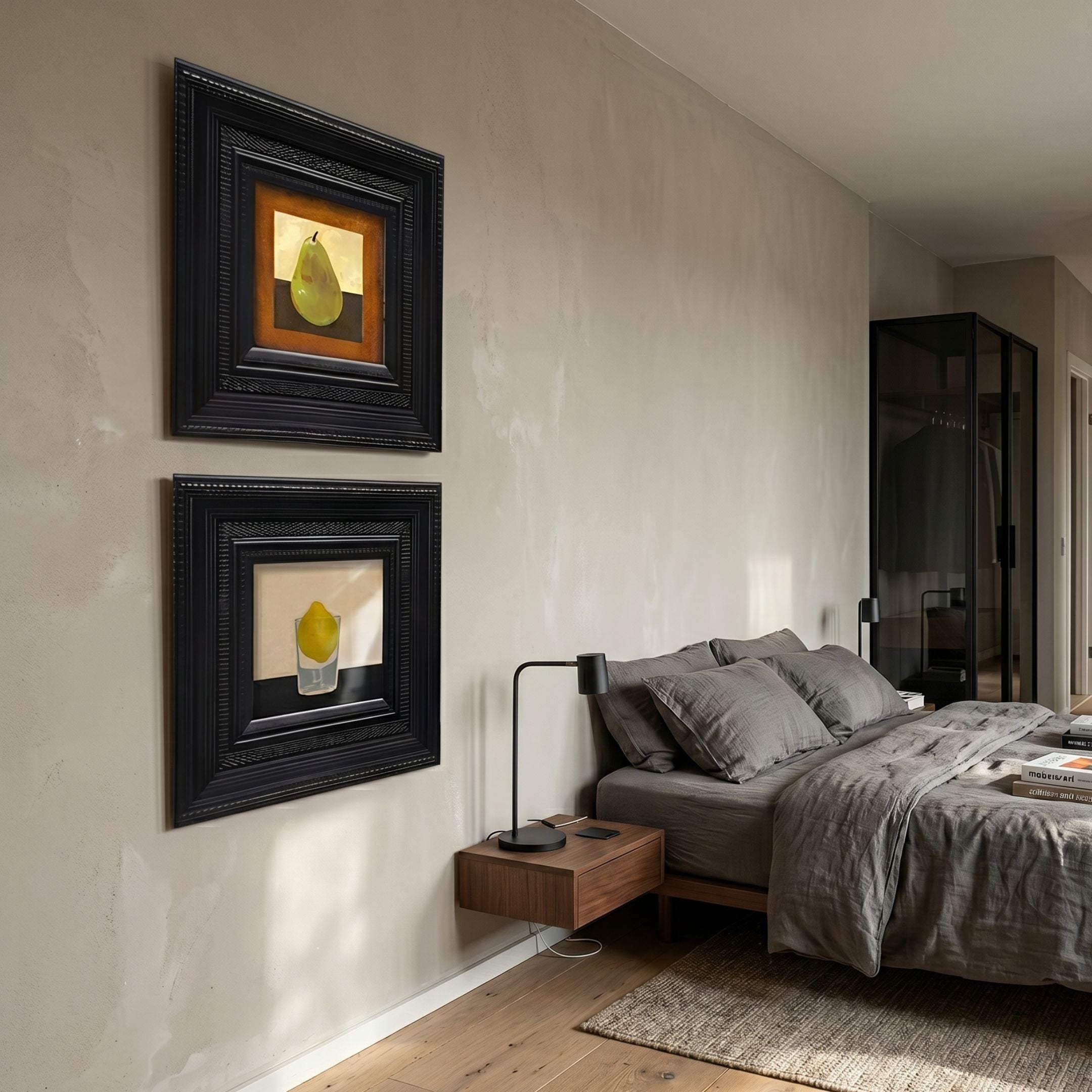 Artelis 2-Set Pear & Lemon Still Life Framed Wall Art displayed vertically on a beige bedroom wall beside a grey linen bed and walnut floating nightstand.