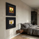 Artelis 2-Set Pear & Lemon Still Life Framed Wall Art displayed vertically on a beige bedroom wall beside a grey linen bed and walnut floating nightstand.