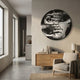 Lunoria Hands Frame Face Round Wood Embossed Wall Art displayed on a beige wall above a wooden sideboard in a modern living room with armchair.