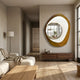 Orrana Gold & White Organic Round Mirror 3D Wall Art by Giant Sculptures mounted in a neutral living room above a walnut sideboard beside a beige sofa.