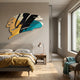 Cavoya Yellow & Teal Brushstroke Abstract Wall Art mounted above a grey upholstered bed with mustard throw, copper lamp, and timber nightstand in a sunlit bedroom.