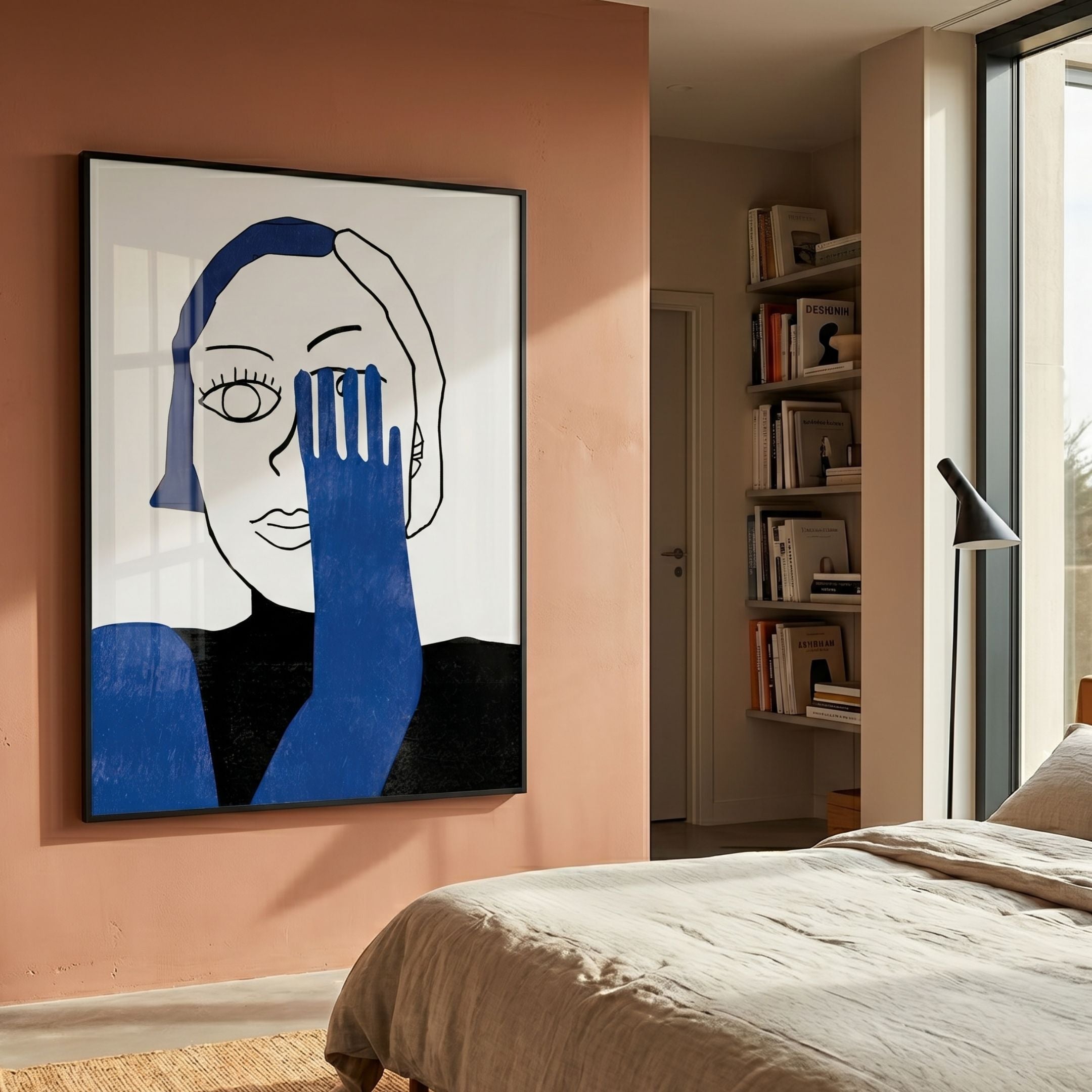 Cavoya Blue Gaze Figurative Crystal Porcelain Wall Art by Giant Sculptures displayed on a terracotta bedroom wall beside a bookshelf, floor lamp, and linen bed.