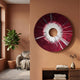 Solyra Crimson Circular Textured Wood 3D Wall Art by Giant Sculptures mounted on a terracotta wall above a console in a living room with a fiddle-leaf fig.