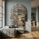Aurargent Arch Layered Silver Mirror 3D Wall Art by Giant Sculptures, mounted on a grey wall above a grey sofa in a living room with wood flooring and bookshelves.