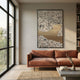Aurista Figurative Abstract Cotton Spray Wall Art by Giant Sculptures hung above a rust velvet sofa in a sunlit living room with floor-to-ceiling windows.