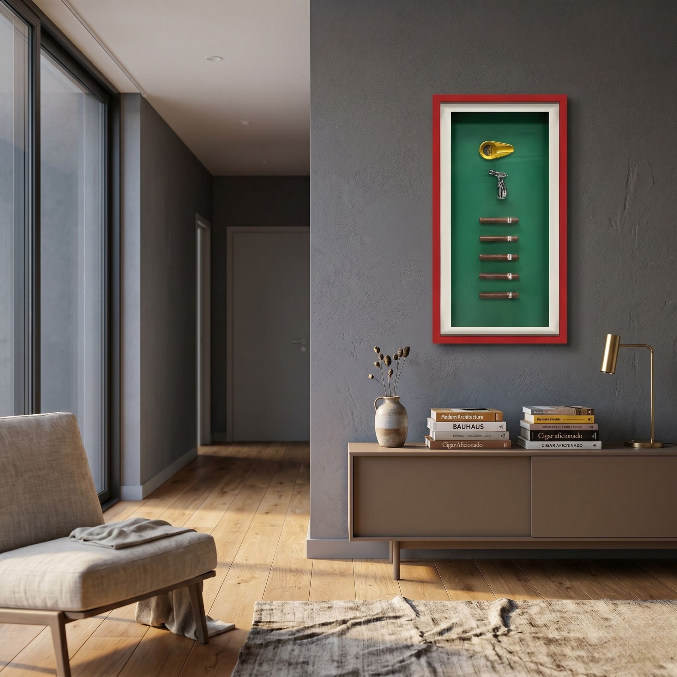Cavendor Cigar & Torch Green Framed Wall Art by Giant Sculptures displayed on a grey hallway wall above a taupe console with books, vase, and brass lamp.