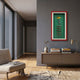 Cavendor Cigar & Torch Green Framed Wall Art by Giant Sculptures displayed on a grey hallway wall above a taupe console with books, vase, and brass lamp.