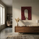 Arclunor Merlot Red Arch Relief Mirror 3D Wall Art by Giant Sculptures displayed above a walnut sideboard with pampas grass in a minimalist living room.
