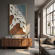 Pisaro Gold Fish Ocean Edge & White Oil Canvas 3D Wall Art in a gold frame above a walnut sideboard in a grey-walled living room with large windows.