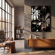 Floristra III Petal Bloom Silver Mirror 3D Wall Art with bold black-and-white floral design displayed above a wooden console in a sunlit modern living room.